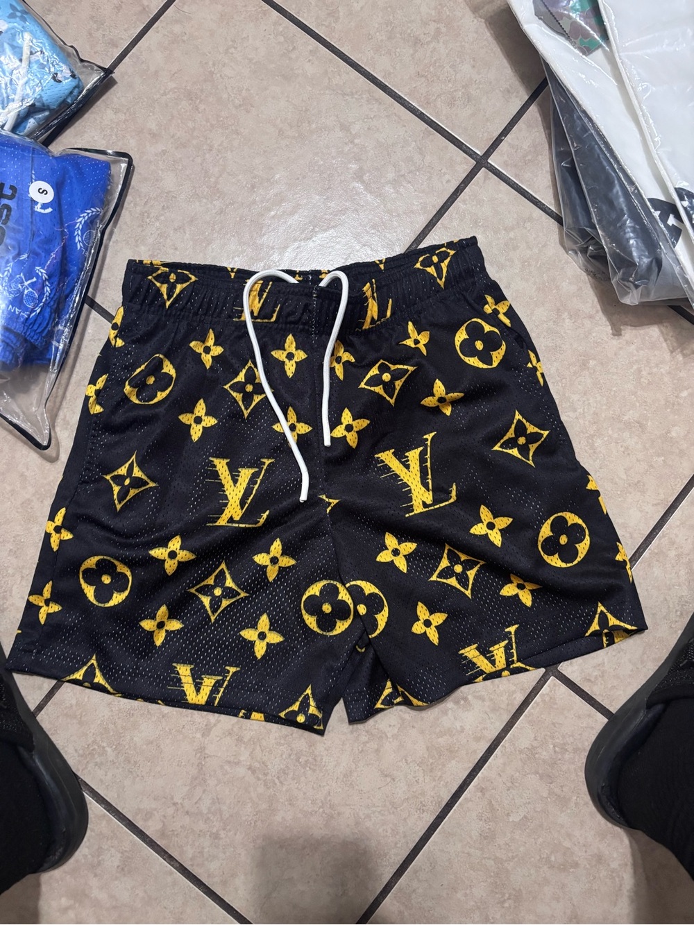 Bravest Studios Black Athletic Shorts with Yellow Logo Print